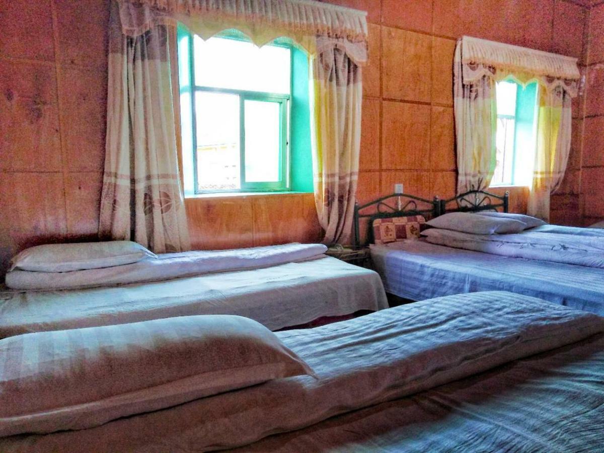 Zishuo Zihua Guest House Daocheng Exterior foto